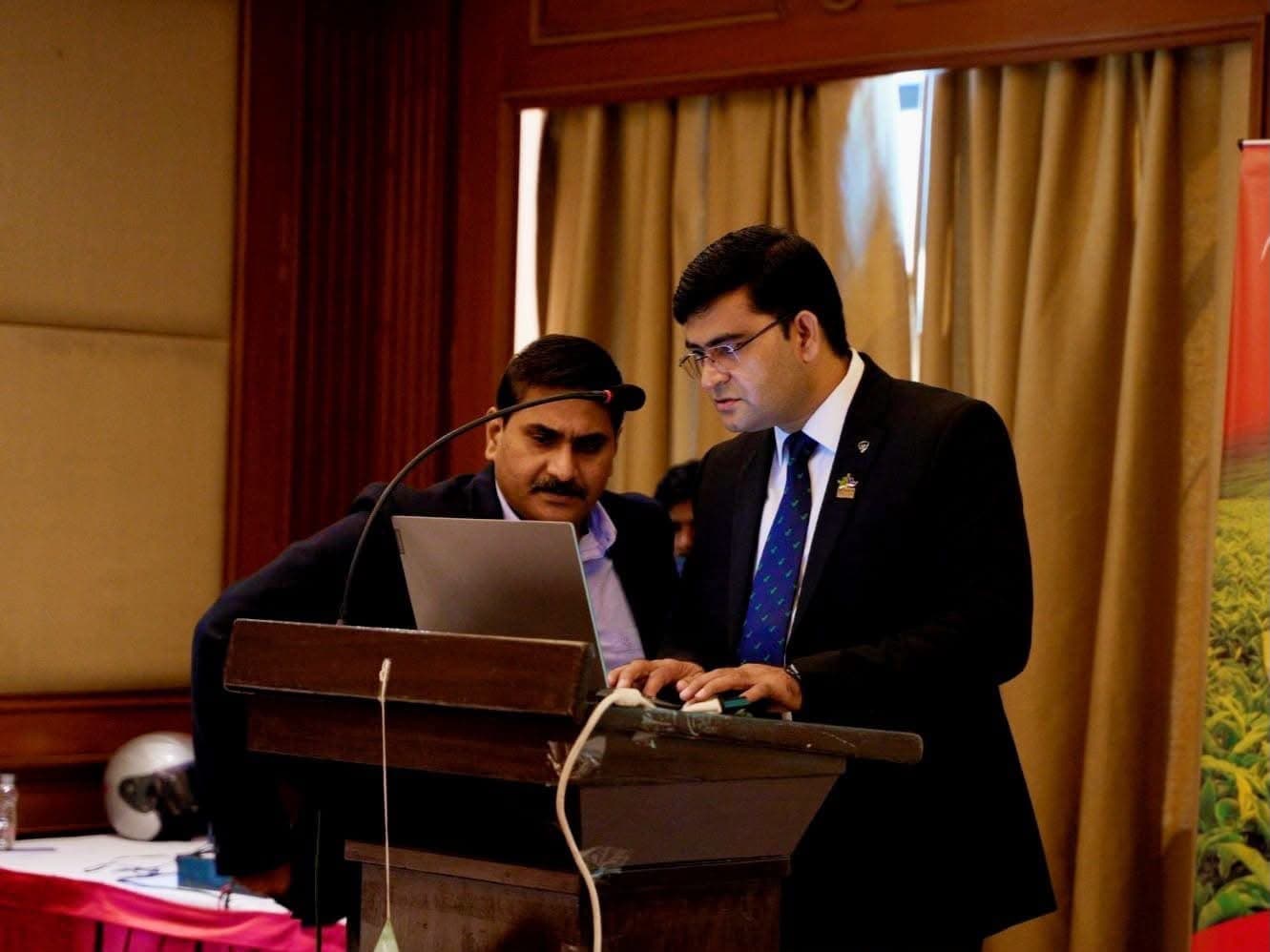 Aadesh Sharma at the lectern preparing a presentation